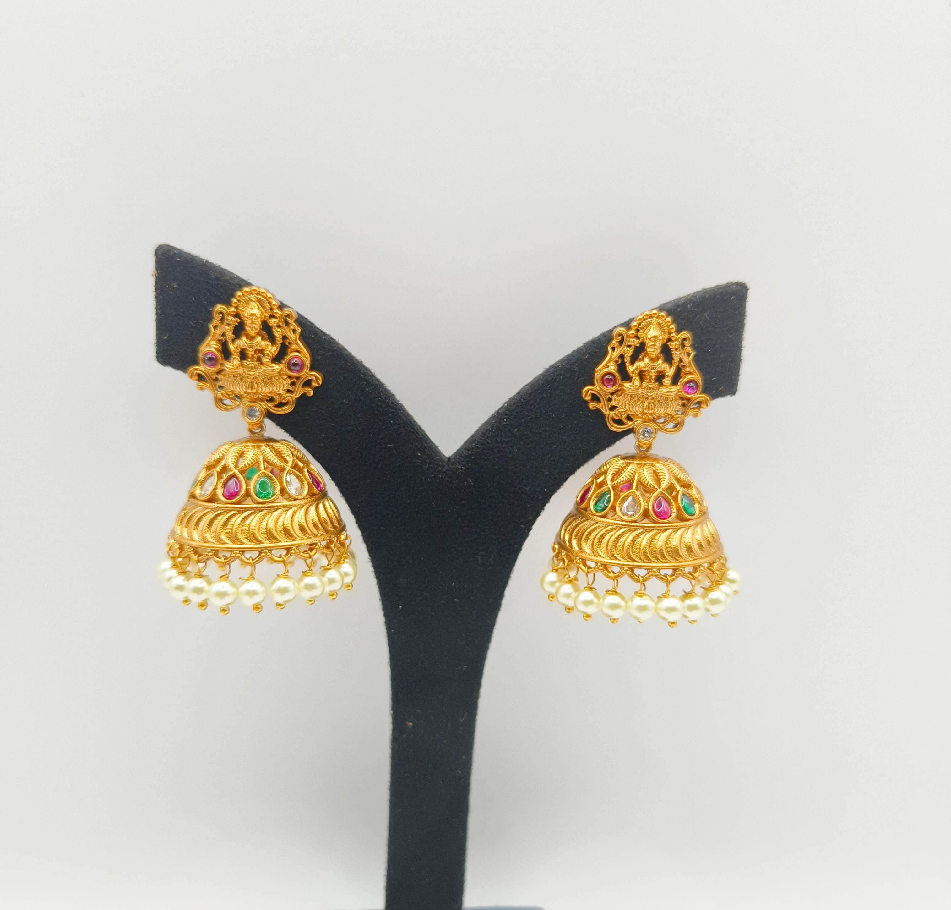 Elegant earring collection featuring studs, hoops, and drops